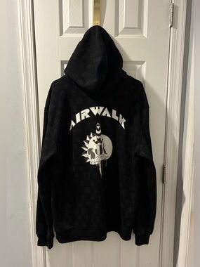 Women’s Airwalk Black Hoodie with White Skull Graphic. Size XL. $10